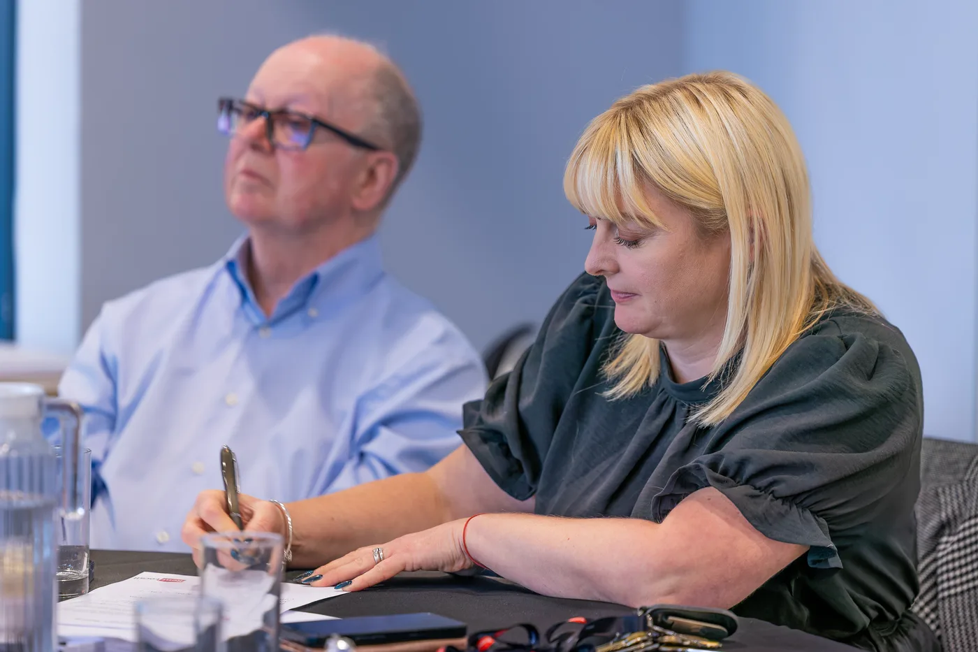 RentLocally colleagues taking notes at a property management conference